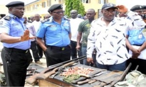 L-R: The Force Public Relation Officer, CP Emmanuel Ojukwu, Commissioner of Police for Kogi State, Mr Sikiru Ogunjemilusi and Commissioner of Police, Federal  Special Anti-Robbery Squad, Mr Chris Ezike, during the inspection of stolen cars and rifles recovered from armed bandits in Kogi State on Monday