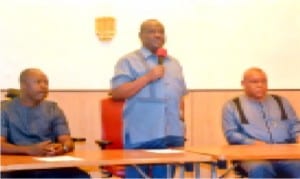 Governor of  Rivers State, Chief  (Barrister) Nyesom  Wike (standing), addressing journalists at Government House, Port Harcourt last Saturday. With him are former Minister of Sports, Hon Tammy Danagogo (left) and Special Adviser to the Governor on Media and Publicity Mr Opunabo Inko-Tariah.             Photo Prince Dele Obina  