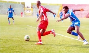 Action between Dolphins and Sharks FCs in a Globacom Premier League game at the Liberation Stadium, Port Harcourt