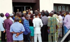 Some family members of the CBN  fraud case suspects at the court premises in Ibadan, yesterday.