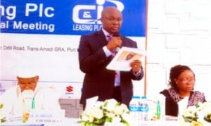 Company Secretary, Mr. Mbanugo Udenze  (middle), reading the 2014 Annual Report of C&I Leasing to participants in Port Harcourt, yesterday. With him are the Chairman, C&I Leasing, Air Vice-Marshall A.D. Bello (left) and Executive Director, Mrs. N.U.I Uche                               Photo: Obinna Prince Dele