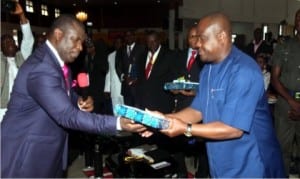 Rivers State Governor, Chief Nyesom Wike (right) receiving a souvenir from State Chairman of Christian Association of Nigeria (CAN),Apostle Zilly Aggrey, during the Women’s Day celebration service at Royal House of Grace International Church, Port Harcourt, yesterday.