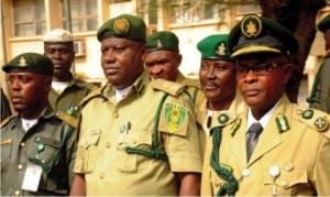 L-R Chief  Superintendent of Prisons, Dr Chijioke Onwe; Controller of Prisons, Enugu Command, Mr Ikechukwu Uchenwa and Deputy Controller of  Prisons, Mr Fred Akam, at a reception for newly promoted officers of Enugu Prisons Command in Enugu last Sunday.