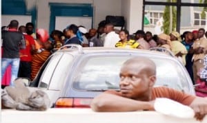 Customers queuing to obtain Bank Verification Number (BVN) at a bank in Garki, Area 3 in Abuja on Monday.