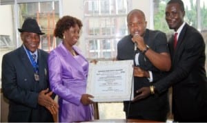 L-R: Administrative Secretary, Independent National Electoral Commission, Rivers State , Mr Roy Obijuru, the Resident Electoral Commissioner (REC), Dame Gesila Khan, President, New Rivers Vision Students (NRVS), Mr Chimzi Ihunwo and Publicity Secretary of NRVS, Mr Kelvin Mopho, at the presentation of a Meritorious Award to the REC by NRVS in Port Harcourt, yesterday
