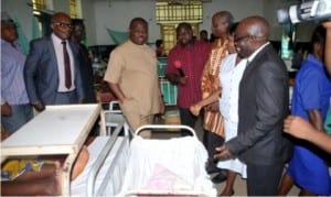 Governor Nyesom Wike admires a child born during the inspection tour of General Hospital, Bori.