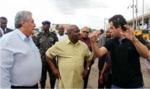 Rivers State Governor, Chief Nyesom Wike (middle), listening to Eyas Nassar (right), during inspection tour at Trans-Amadi Slaughter Road, while Engr. Igor Zavodic watches.