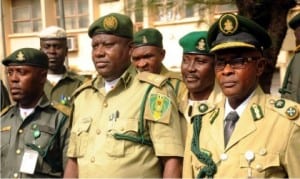 From L-R: Cheif Superintendent of Prisons, Dr Chijioke Onwe; Controller of Prisons, Enugu Command, Mr Ikechukwu Uchenwa and Deputy Controller of Prisons, Mr Fred Akam, at a reception for newly promoted officers of Enugu Prisons Command in Enugu, recently.       					        Photo: NAN