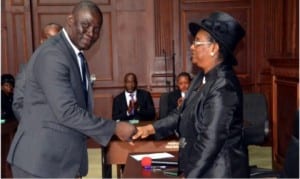 Ag Chief Judge of Rivers State, Justice Daisy Wotube Okocha (right) congratulating Emeka Frank Onyeka, shortly after taking oath of office as one of the new Notary Publics in Port Harcourt, recently