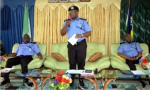 Rivers State Commissioner of Police, Mr Chris Okey Ezike (middle), addressing pressmen in Port Harcourt during a press briefing. With him are Mr H. Agbonlahor (left) and Mr F. Odesanya