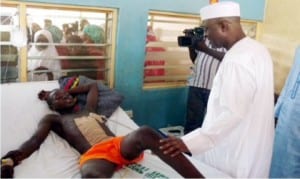 Former Governor of Adamawa State, Mr Bala Ngillari (right), sympathising with a victim of the recent Jimeta Market bomb blast at the Federal Medical Centre in Yola, recently.