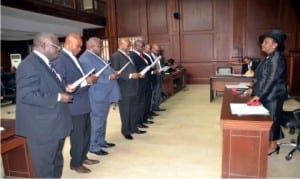 Acting Chief Judge of Rivers State, Hon. Justice Daisy Okocha (right) administring the Oath of Office for newly appointed members of Notary Public at the High Court complex, Port Harcourt, ercently.