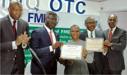 L-R: Former Chairman, Board of Directors, Financial Market Dealers Quotation (FMDQ) OTC Plc, Aigboje Aig-Imoukhuede, Group Managing Director, Uba Group, Phillip Oduoza, Director-General, Debt Management Office, Dr Abraham Nwankwo, Managing Director of Fmdq, Bola Onadele Koko and Chief Executive Officer, Chapel Hill Advisory Partners Ltd, Bolaji Balogun, at the bond listing of the Federal Government on FMFQ platform in Lagos, on Monday.