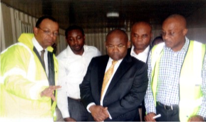 Sole Administrator, Greater Port Harcourt City Development Authority (GPCDA), Amb. Desmond Akawor (middle), listening attentively to the explanation by the Secretary to the Board of the Authority, Mr John Singer (left), during an inspection visit to projects sites by the Administrator recently Photo: Ibioye Diama