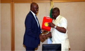 Rivers State Governor, Chief Nyesom Wike (right), receiving a souvenir from the Managing Director of Shell Petroleum Development Company of Nigeria (SPDC), Mr Osagie Okunbor during a courtesy call in Government House, Port Harcourt.