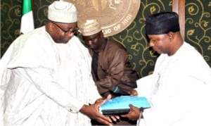 Governor Muhammed Abubakar of Bauchi State (left), receiving budget report from the Chairman of Budget Review Committee and the State Head of Civil Service, Mr Abdon Gin in Bauchi, yesterday.