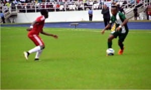 A Nigerian player (right) trying to dribble past a Congolese oppoenent when both teams clashed in Port Harcourt on Sunday. 