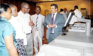 Deputy General Manager, Sharp Altect International, Mr Varghese Gorge (right), speaking to newsmen at the live demonstration of New Age Digital Printing and Finishing in Abuja, last Monday. With him is the Managing Director, First October Global Resources Ltd, Mr Wale Akindele (2nd right)