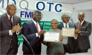 L-R: Former Chairman, Board of Directors, Financial Market Dealers Quotation (fmdq) Otc Plc, Aigboje Aig-Imoukhuede, Group Managing Director, Uba Group,Phillip Oduoza, Director-General, Debt Management Office, Dr Abraham Nwankwo, Managing Director of fmdq, Bola Onadele Koko and Chief Executive Officer, Chapel Hill Advisory Partners Ltd, Bolaji Balogun, at the bond listing of the Federal Government on fmdq platform in Lagos, recently.