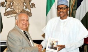 President Muhammadu Buhari (right), receiving a book from the former Commonwealth Secretary-General, Sir Shridath Ramphal, at the Presidential Villa in Abuja, last Monday