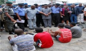 Governor Nyesom Wike of Rivers State (3rd-left), Commissioner of Police, Rivers Command, Mr Chris Ezike (2nd-left), and National Chairman of pdp, Mr Uche Secondus (4th-left), during parade of suspects by the Commissioner of Police in Port Harcourt, last Monday.