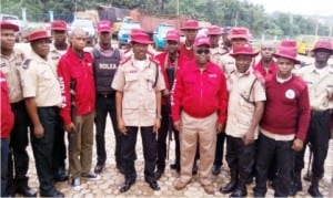 Sector Commander Frsc, Anambra State, Mr Sunday Ajayi (middle), Commander, Ndlea  in Anambra State, Mr Sule Momodu (3rd right) addressing officers of the Joint Team at the Frsc State Headquarters in Awka yesterday