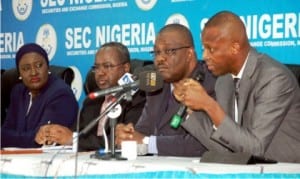 L-R: Executive Commissioner, Legal and Enforcement, Securities and Exchange Commission (SEC), Sa'adatu Bello, Director-General, Mr Mounir Gwarzo, Executive Commissioner, Corporate Services, Mr Zakawanu Garuba and Executive Director, Nigeria Stock Exchange, Mr Ade Bajomo, during a news conference on the second quarter Post Capital Market Committee (CMC) meeting in Lagos, yesterday.