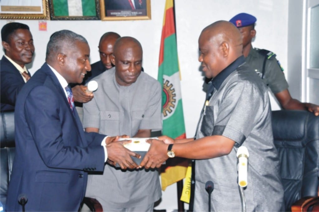 Rivers State Governor, Chief Nyesom Wike (right), receiving a souvenir from Managing Director, Port Harcourt Refinery Company, Dr. Bafred Audu Eujugu, supported by Caretaker Committee Chairman, Eleme Local Government Council, Mr. Philip Okparaji (middle), during the governor’s visit to the refinery, last Wednesday.