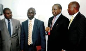 L-R: Deputy Director, Securities and Exchange Commission (SEC), Alhaji Hassan Suleiman, Executive Director, Business Process, Nigeria Inter-Bank Settlement System (NIBSS) Mr. Niyi Ajao, Director- General, Securities and Exchange Commission, Mr Mounir Gwarzo and Head, (NIBSS), Mr. Samuel Oluyemi, at the Launch of the e-dividend Portal in Lagos on Wednesday