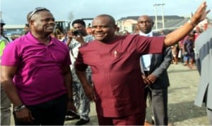Governor Nyesom Wike of Rivers State (middle), with a Director in MCC, Mr Nelson Jaja (left), during an inspection of Rumuolumeni Road project in Port Harcourt, recently.             Photo: NAN