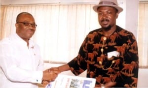 General Manager, Rivers State Newspaper Corporation, Mr Celestine Ogolo (left), presenting copies of The Tide  to Federal Commissioner, Public Complaints Commission, Rivers State, Dr Alphaus Paul-Worika, during a facility visit to the corporation, on Friday.