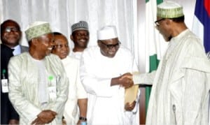 President Muhammadu Buhari (right), in a handshake with the Registrar, Council of Nigerian Mining Engineers and Geoscientists, Mr Bello Baguje, after his meeting with officials of the Ministry of Solid Mineral Development at the Presidential Villa in Abuja, yesterday