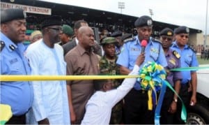Rivers State Governor, Chief Nyesom Wike (3rd left), watching as the Inspector General of Police, Mr. Solomon Arase (3rd right), commissioned 64 patrol utility security vans for the police and other security agencies in Rivers State, in Port Harcourt, yesterday