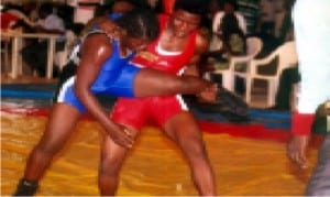 Female wrestlers showing off their skills in a bout