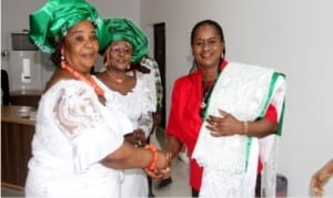 Rivers State Deputy Governor, Dr Ipalibo Banigo (right), being decorated as Patron by the President, Market Women and Men Association of Nigeria, Rivers State chapter, Mrs Charity Abonyo (left), while the state Secretary, Mrs Helen Iyalla watches, during their courtesy visit to Government House, Port Harcourt, yesterday.