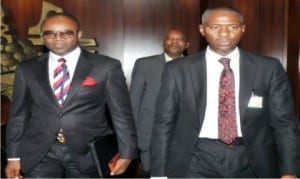 The new Managing Director of  NNPC, Dr Emmanuel Ibe Kachikwu (left), being led into the Presidential Villa by the Liason Officer, Mr Nura Rimi, in Abuja, on Wednesday