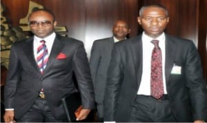 The new Managing Director of NNPC, Dr Emmanuel Ibe Kachikwu (left), being led into the Presidential Villa by the Liason Officer, Mr Nura Rimi, in Abuja, on Wednesday