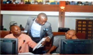 Member representing Asari-Toru Constituency II in the Rivers State House of Assembly, Hon. Enemi George (middle), conferring with his Akuku-Toru Constituency I counterpart, Hon. Granville Wellington (left) and the member for Etche Constituency II, Hon. Tony Ejiogu, during a sitting in Port Harcourt, recently.                                       Photo: Chris Monyanaga