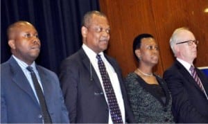 Company Secretary, Stanbic IBTC, Mr Chidi Okezie, Chairman, Mr Atedo Peterside, the Chief Executive, Sola David-Borha and Non-Executive Director, Mr Dominic Bruynseels, at the extraordinary general meeting of the bank in Abuja, on Thursday