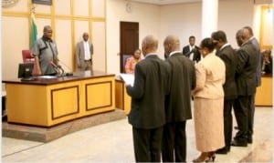 Rivers State Governor, Chief Nyesom Wike (left), swearing in new Permanent Secretaries at the Government House, Port Harcourt on Friday