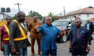 Rivers State Governor, Chief Nyesom Wike (middle), discussing with Engr. Rowland Otabah (left), during an inspection of Evo road project, while Chief of Staff, Government House, Engr. Emeka Woke (right) watches in Port Harcourt recently
