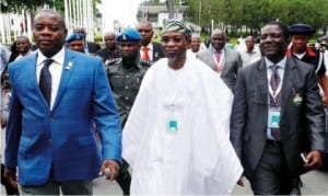 L-R : President, Council for the regulation of  Engineering in Nigeri (COREN), Mr Kashim  Ali, Governor Rauf Aregbesola of  Osun State and President, Nigerian Society of Engineers, Mr  Ademola Olorunfemi, at the 24th Engineering  Assembly of COREN  in Abuja on Tuesday.