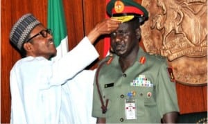 President Muhammadu Buhari (left), decorating the Chief of Army Staff, Maj.-Gen. Tukur Buratai with his new rank of Lt.-Gen, at the Presidential Villa in Abuja, yesterday