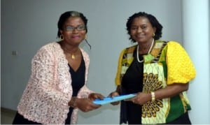Chairman, Nigeria Association of Women Journalists (NAWOJ), Rivers State Chapter, Mrs Lilian Okonkwo (left), handing over a document to the State Deputy Governor, Dr Mrs Ipallibo Harry-Banigo, during a courtesy visit to Government House, Port Harcourt on Tuesday.