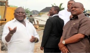 Project Supervisor, Bulletin Construction Company, Mr. Ajayi (left), briefing Governor Nyesom Wike of Rivers State (right) on the level of work done during the inspection of the Obio/Akpor International Market Road project in Rukpokwu community, near Port Harcourt by the governor recently.