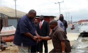 Governor Nyesom Wike of  Rivers State (right), in a handshake with the Chief Executive Officer of  Monier Construction Company (MCC), Senator John Mbata, during the inspection of  Rumuolumeni  Road  project  in Port Harcourt recently