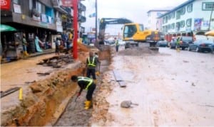 Workers of CCECC Construction Company on duty at a road project site in Diobu, Port Harcourt  