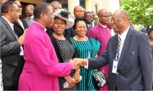 Archbishop, Metropolitan and Primate of All Nigeria, Most Revd Nicholas Okoh (2nd left), in handshake with the former Governor Edo State, Prof. Osareme Osunbor (right), at the Conference of Chancellors, Registrars and Legal Officers in Abuja, yesterday