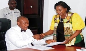 Rivers State Deputy Governor, Dr. Ipalibo Harry Banigo, receiving an address from the President, Sorglues and Care Development Foundation, Mr. Kle Obomanu (middle), during a courtesy call in Government House, Port Harcourt, recently