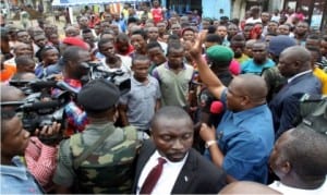 Governor Nyesom Wike of Rivers State (2nd right), addressing protesting bus drivers over the killing of their colleague by a policeman in Port Harcourt recently.